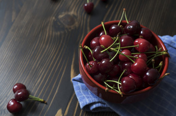 Wall Mural - Cherries. Cherry. Cherries in color bowl and kitchen napkin.