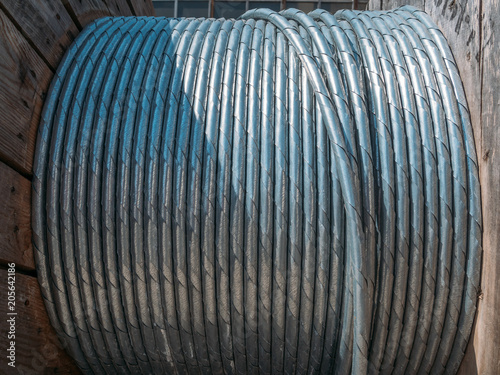 Fotografie, Obraz New twisted steel cable coil wire or steel rope, industrial metallic cable line