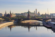 Moscow Kremlin on a Moskva river embankments background. View from Patriarshiy bridge in sunny spring morning