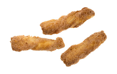 Wall Mural - Top view of a group of crunchy baked twisted cookies isolated on a white background.