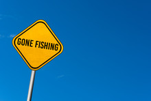 Gone Fishing - Yellow Sign With Blue Sky