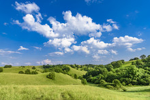 Beautiful Green Hills With Cloudscape And Blue Sky