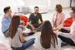 © Africa Studio - People at group psychotherapy session indoors