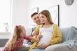 © New Africa - Young pregnant woman with her family at home
