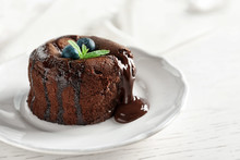 Plate Of Delicious Fresh Fondant With Hot Chocolate And Blueberries On Table. Lava Cake Recipe