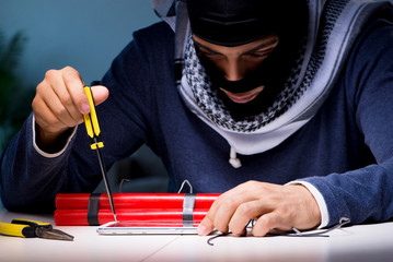 Wall Mural - Terrorist bomber preparing dynamite bomb