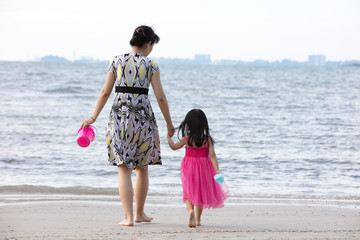 Wall Mural - Asian Chinese mum and daughters playing sand together