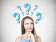 © ImageFlow - Young pensive woman, question mark