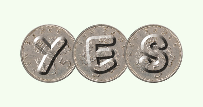 YES written with old British coins on green background