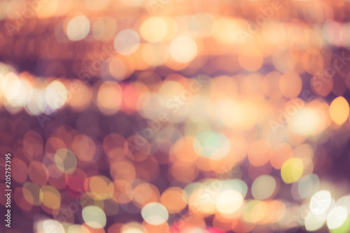Fotografiet Defocused bright city lights blur with buildings and traffic