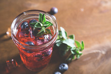 Natural Lemonade With Fresh Blueberries And Herbs