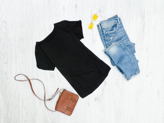 Wall Mural - Black T-shirt, ripped jeans, handbag and sunglasses. Fashionable concept