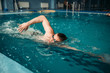 © Nomad_Soul - Male swimmer swims on workout in swimming pool