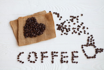  I Love Coffee phrase spelled out of roasted coffee beans isolated on white background