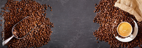 Nowoczesny obraz na płótnie cup of coffee and coffee beans in a sack, top view