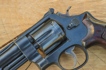 Wall Mural - Handgun close up on wooden background