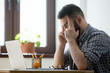 © fizkes - Frustrated businessman concerned male worker looking at laptop screen heavily thinking about problem solution, person evaluating taking risk, counting business success chances on market. Self control