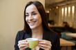 © My Ocean studio - Happy gorgeous Business woman with cup of coffee during lunch time on coffee shop