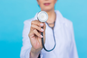 Female doctor with stethoscope, close up