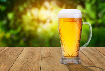 Wall Mural - beer with green blurred background