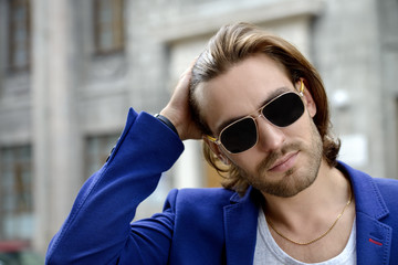 Wall Mural - young man in sunglasses