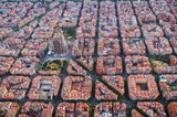 Fototapeta  - Aerial view of Barcelona Eixample residential district and Sagrada familia, Spain. Late afternoon light