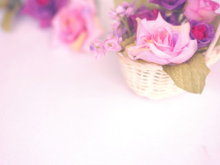 Wall Mural - rose bouquet in small basket on white background