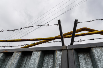 Sticker - Barbed wire against the sky on cloudy day