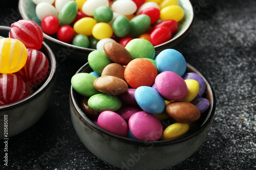 Plakat candies with jelly and sugar. colorful array of different childs sweets and treats