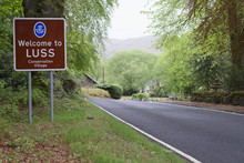 Welcome To Luss Village Sign Greeting Entrance Rural Countryside Town Near Loch Lomond Scottish Place 