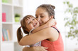 © Oksana Kuzmina - Mom and child daughter embracing at home