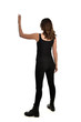 © faestock - full length portrait of brunette girl wearing black singlet, jeans jeans and boots. standing pose, with back view. isolated on white studio background.