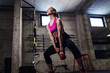© Zoran Zeremski - Fitness woman exercise in the gym with kettlebell.