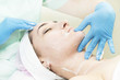© lester120 - Massage and facial peels at the salon using cosmetics