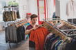 © ReeldealHD images - Young adult male clothes shopping