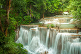 Fototapeta Łazienka - Beautiful and Breathtaking green waterfall at the tropical rain forest, Erawan's waterfall, Located Kanchanaburi Province, Thailand