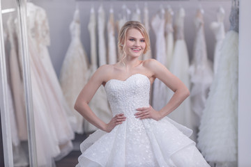 Wall Mural - Smiling young bride in white dress