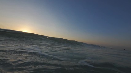 Wall Mural - slow motion shot of sunset surfing wave in indonesia at bali island