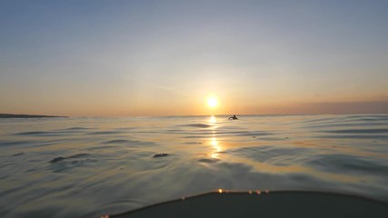Wall Mural - slow motion shot of sunset surfing wave in indonesia at bali island