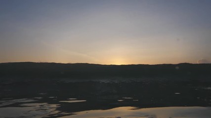 Wall Mural - slow motion shot of sunset surfing wave in indonesia at bali island