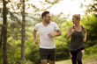 © BGStock72 - Couple jogging outdoors in nature