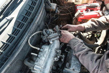 car mechanic repairs the car