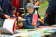 © Free_styler - Children choosing and buying books at the book fair