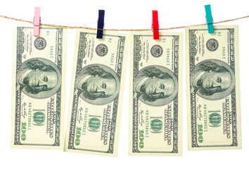 Money dollars clothespins rope on white background isolation