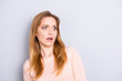 © deagreez - Staring eyes unbelievable people person concept. Close up portrait of pretty woman with big eyes   looking aside on empty blank place near shoulder dressed in casual clothes isolated gray background