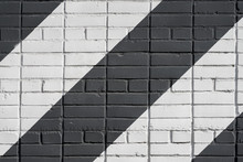 Painted Diagonally Bricks Surface Of Wall In Black And White Color, As Graffiti. Graphic Grunge Texture Of Wall. Abstract Modern Background
