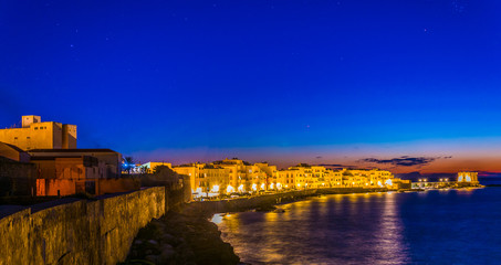 Wall Mural - View of seaside of the sicilian city Trapani during sunset, Italy