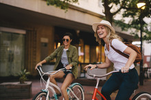 Female Friends Enjoying Bicycle Ride