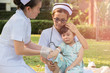 © nareekarn - Children arm treatment her wounds, Children receiving emergency treatment - disinfecting a wounded arm