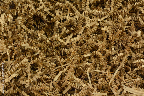 Fotografia, Obraz Close up of crinkled shredded brown paper box filler for shipping fragile items